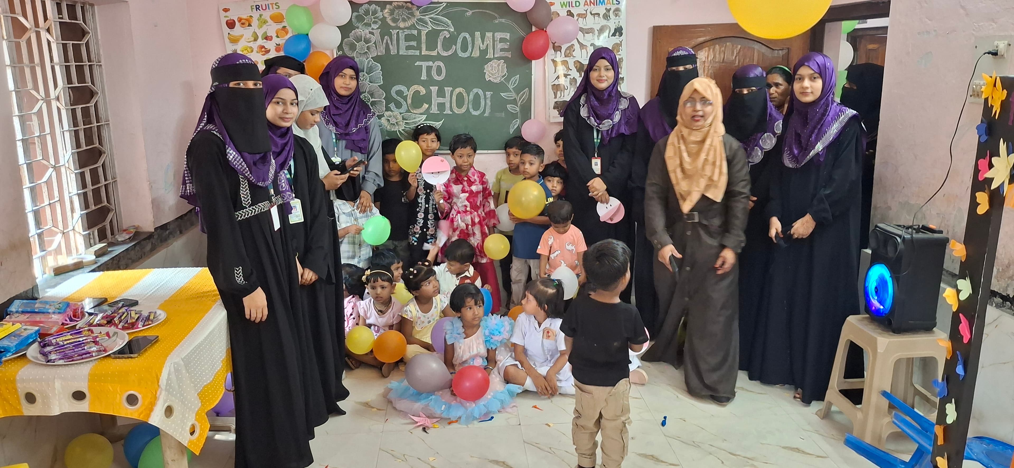 Manara Academy teachers with young students at a welcome celebration